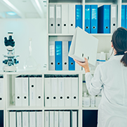 A woman researcher utilizing the health science library 