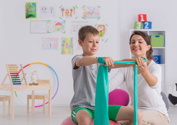 A young boy doing rehabilitation